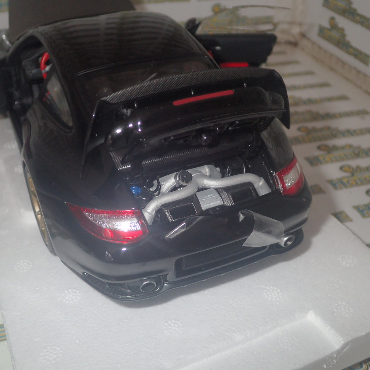 MINICHAMPS 100 069402 - 1/18 SCALE Diecast PORSCHE 911 (997 II) GT2 RS 2011 BLACK W/ GOLD WHEELS