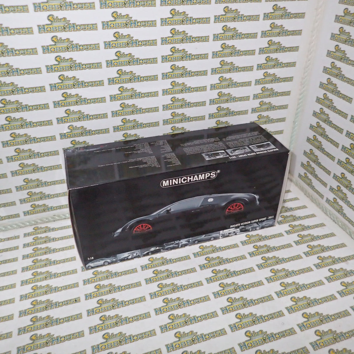 Minichamps 100 110842 - 1/18 Scale Bugatti Veyron Super Sport 2010 in Black Metallic with Orange Rims Diecast Scale Model Replica