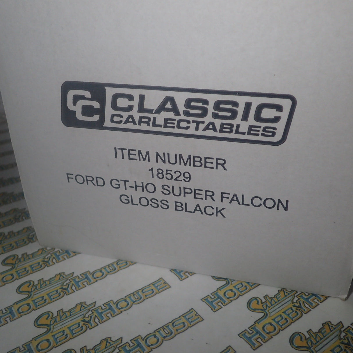 CLASSIC CARLECTABLES 18529 - 1:18 SCALE FORD GT-HO SUPER FALCON GLOSS BLACK DIECAST REPLICA