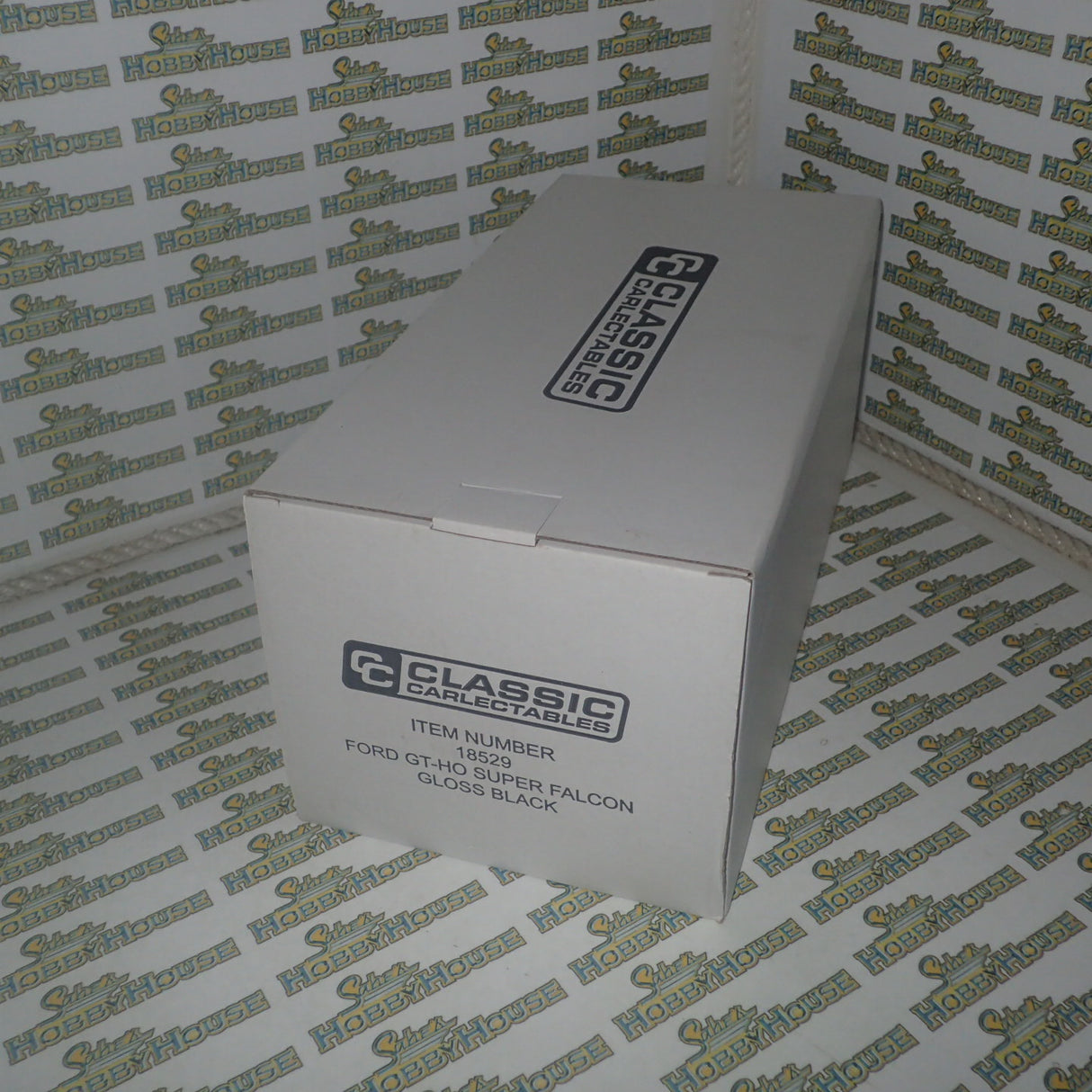 CLASSIC CARLECTABLES 18529 - 1:18 SCALE FORD GT-HO SUPER FALCON GLOSS BLACK DIECAST REPLICA