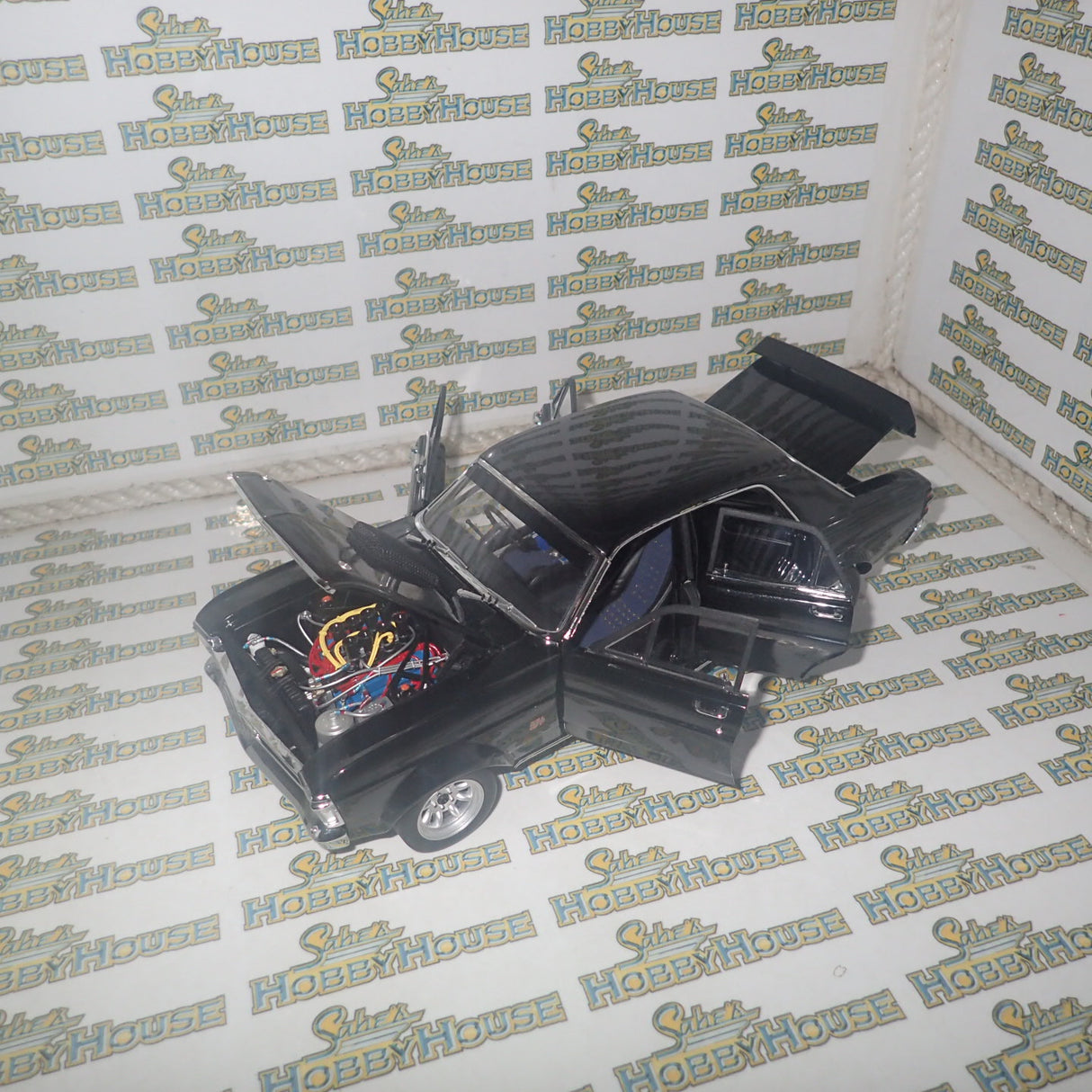 CLASSIC CARLECTABLES 18529 - 1:18 SCALE FORD GT-HO SUPER FALCON GLOSS BLACK DIECAST REPLICA