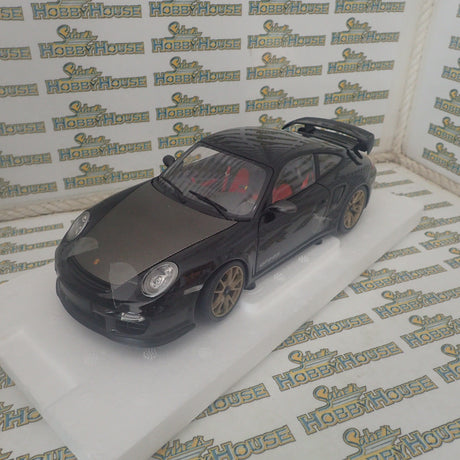 MINICHAMPS 100 069402 - 1/18 SCALE Diecast PORSCHE 911 (997 II) GT2 RS 2011 BLACK W/ GOLD WHEELS