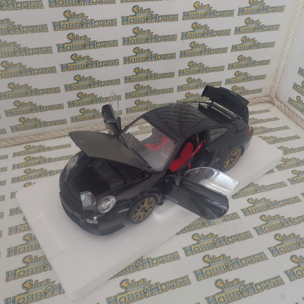 MINICHAMPS 100 069402 - 1/18 SCALE Diecast PORSCHE 911 (997 II) GT2 RS 2011 BLACK W/ GOLD WHEELS