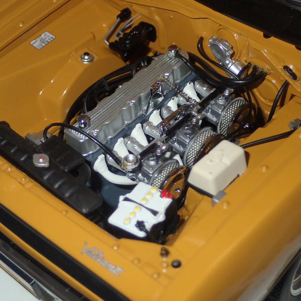 Classic Carlectables 18524 - 1:18 Chrysler VH Valiant E38 R/T Charger Hot Mustard "Small Tank" Die-cast Replica