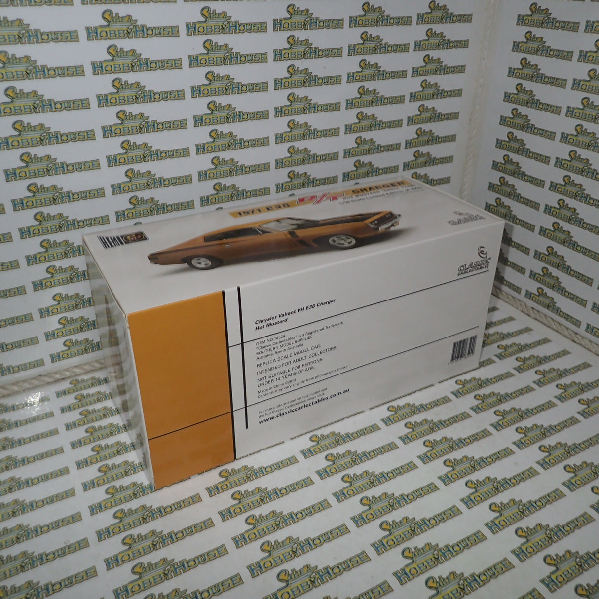 Classic Carlectables 18524 - 1:18 Chrysler VH Valiant E38 R/T Charger Hot Mustard "Small Tank" Die-cast Replica