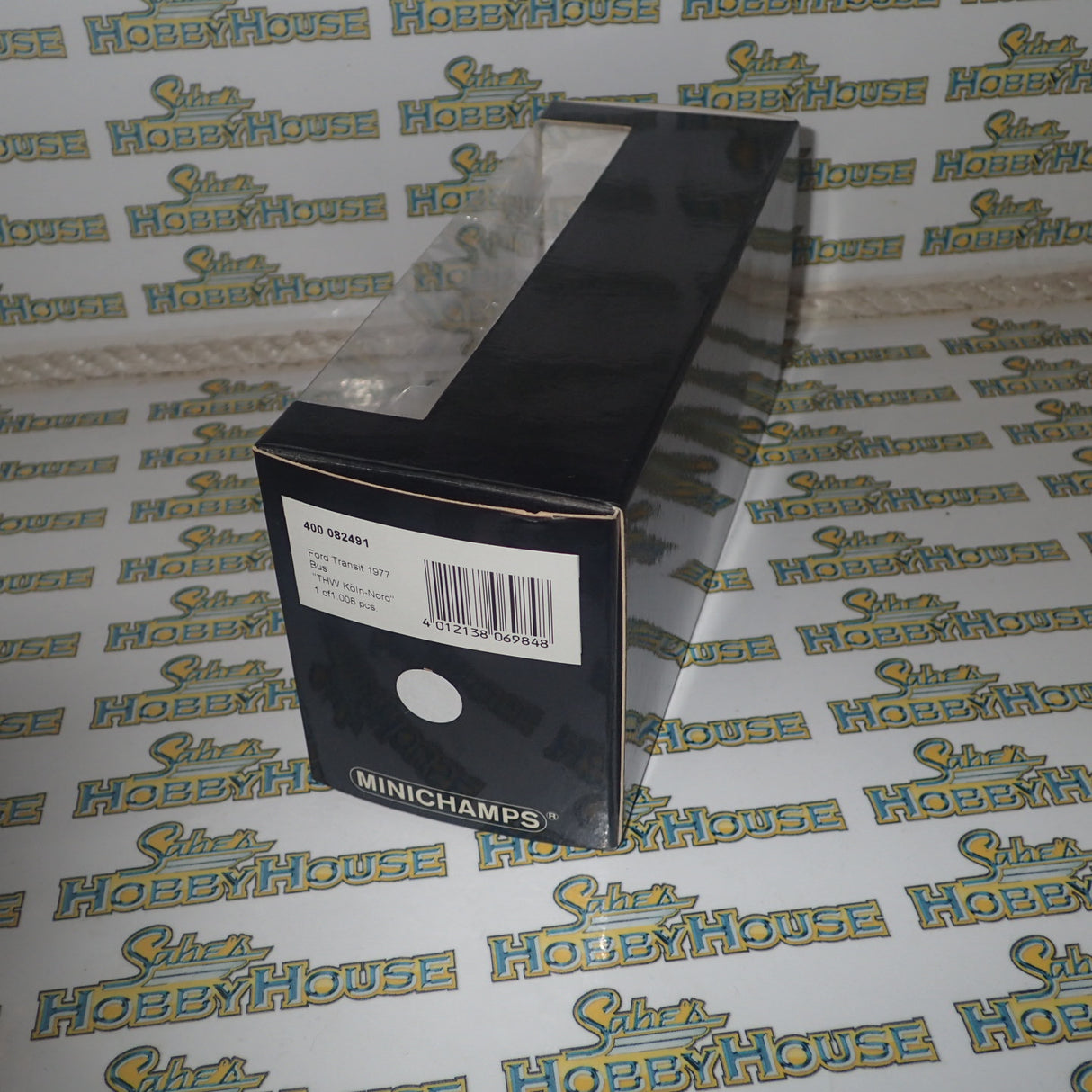 Minichamps 400 082491 - 1/43 Scale - Ford Transit 1977 Bus "THW Koin-Nord" Diecast Model Replica
