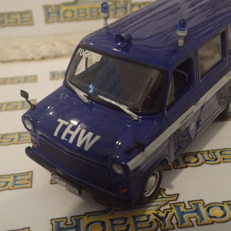 Minichamps 400 082491 - 1/43 Scale - Ford Transit 1977 Bus "THW Koin-Nord" Diecast Model Replica