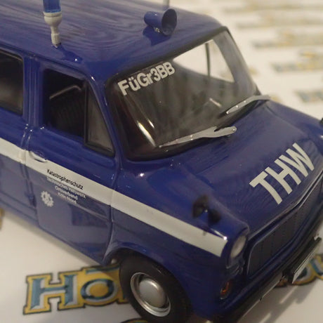 Minichamps 400 082491 - 1/43 Scale - Ford Transit 1977 Bus "THW Koin-Nord" Diecast Model Replica