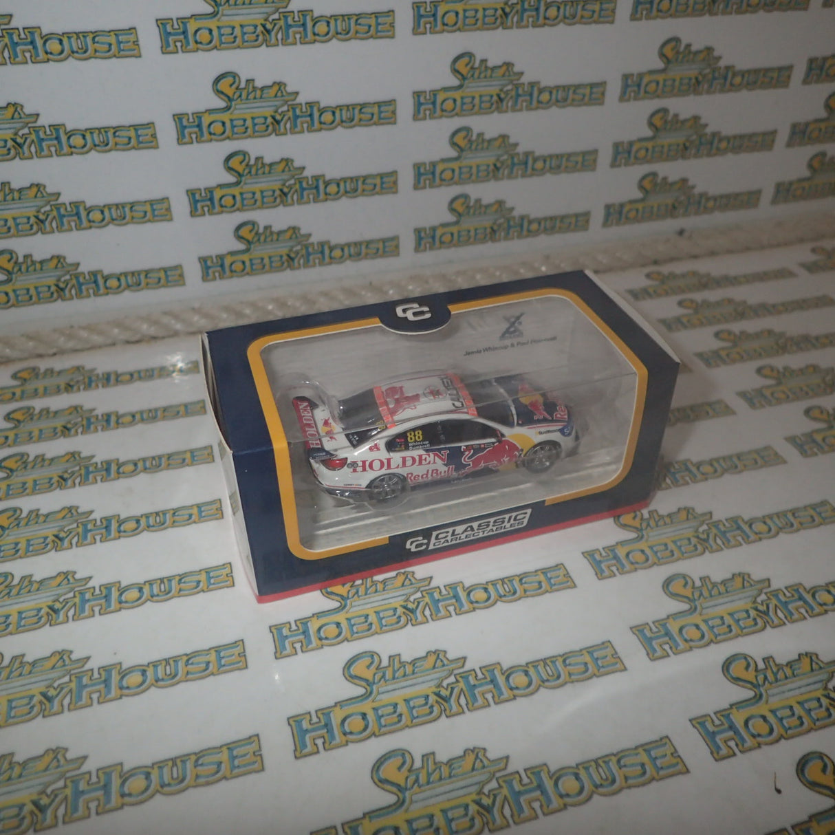 Classic Carlectables 64251 - 1/64 Scale – Holden VF Commodore Red Bull Holden Racing Team's 2017 Sandown Retro Round Livery Jamie Whincup/Paul Dumbrell #88 Diecast Model Replica