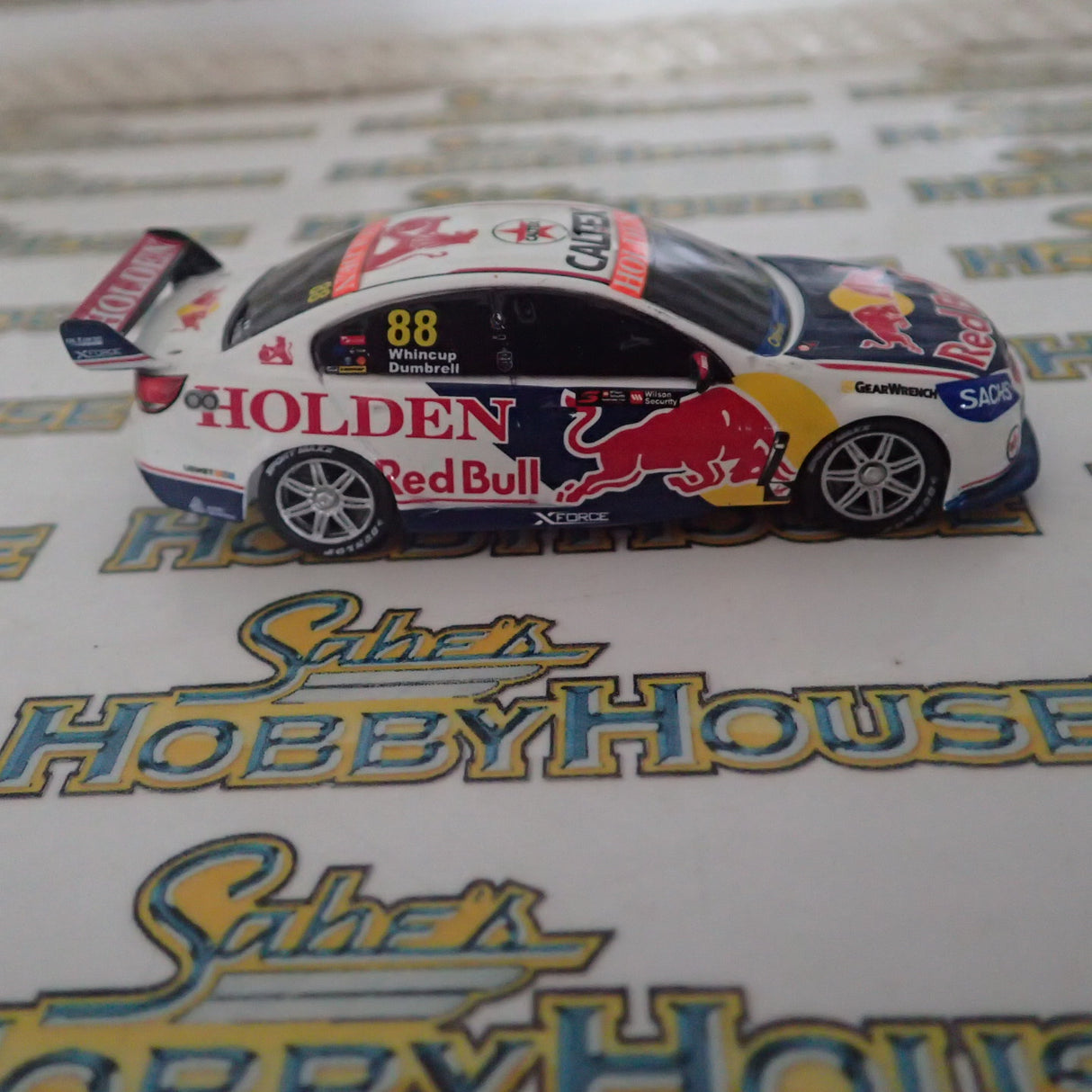 Classic Carlectables 64251 - 1/64 Scale – Holden VF Commodore Red Bull Holden Racing Team's 2017 Sandown Retro Round Livery Jamie Whincup/Paul Dumbrell #88 Diecast Model Replica
