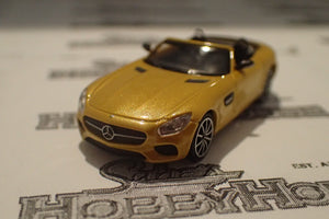 Minichamps - 870 037132 1/87 Scale - Mercedes AMG GTS Roadster 2015 Yellow Metallic