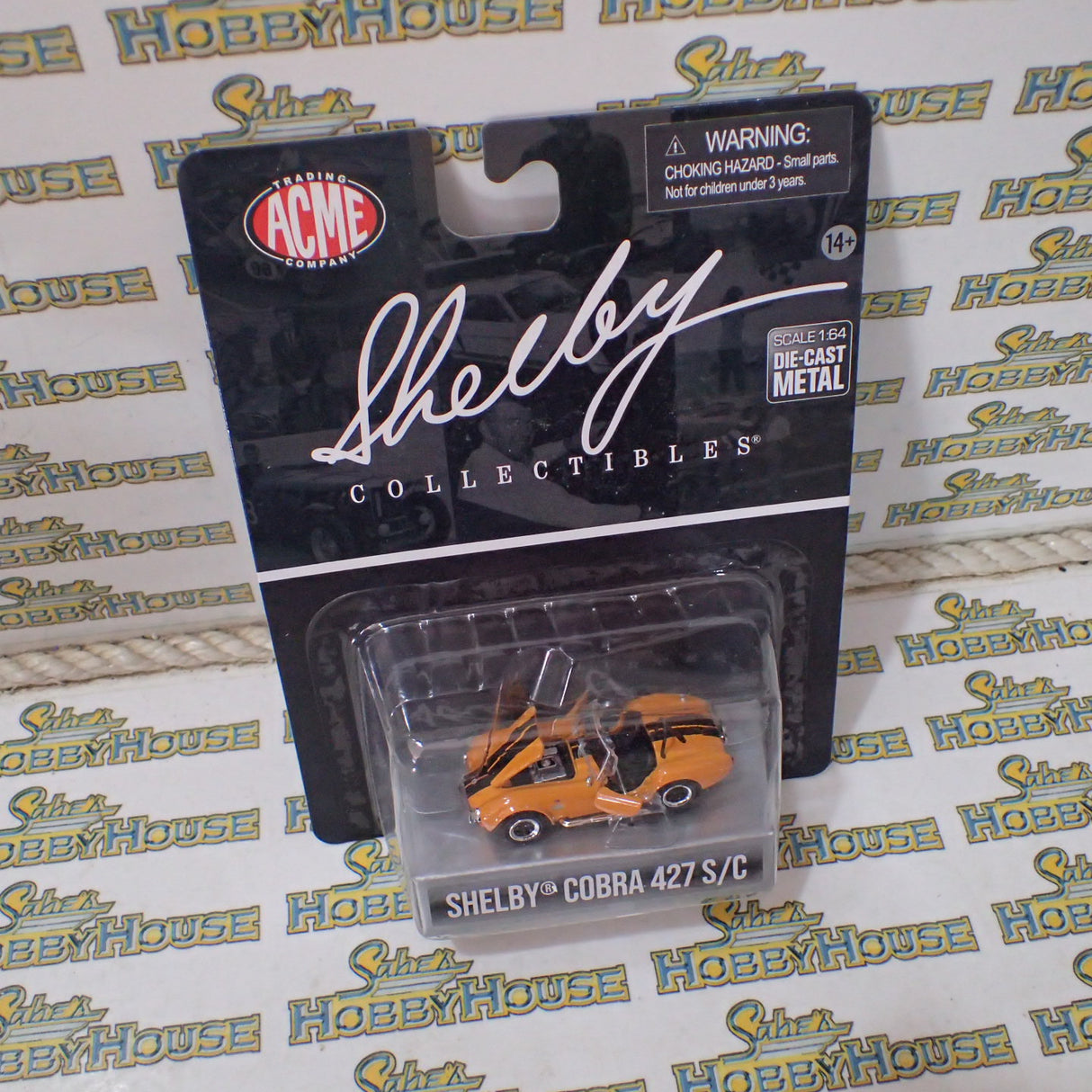 Shelby Collectibles SC-705-O - 1/64 1965 Shelby Cobra 427 S/C - Orange w/ Black Stripes
