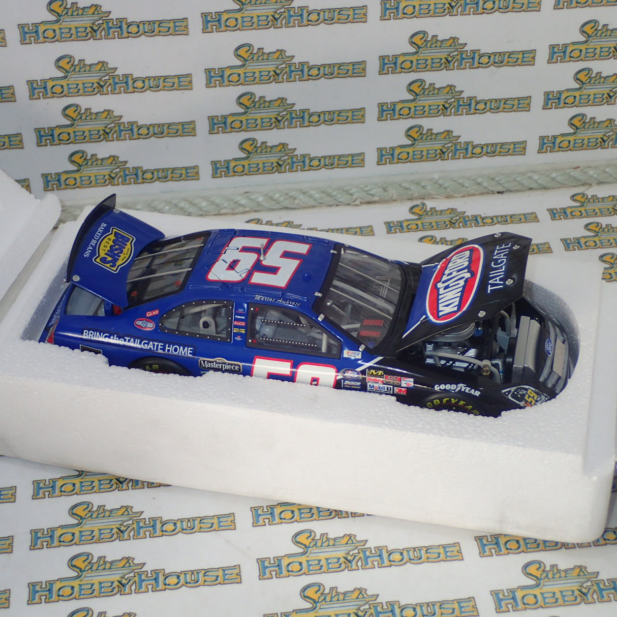 CFS Checkered Flag Sports - 1/24 Scale - Champion Series - 2008 Ambrose #59 “Kingsford Tailgate” Ford Fusion Diecast Model Replica