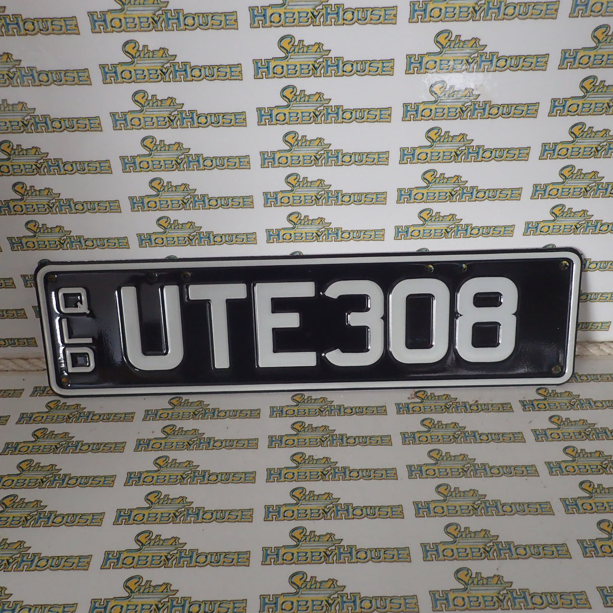Real Queensland Plates. UTE308 with words REAL AUSSIES DRIVE UTES below.
