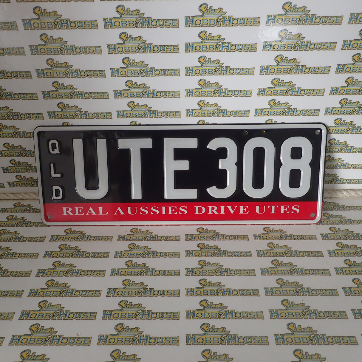 Real Queensland Plates. UTE308 with words REAL AUSSIES DRIVE UTES below.