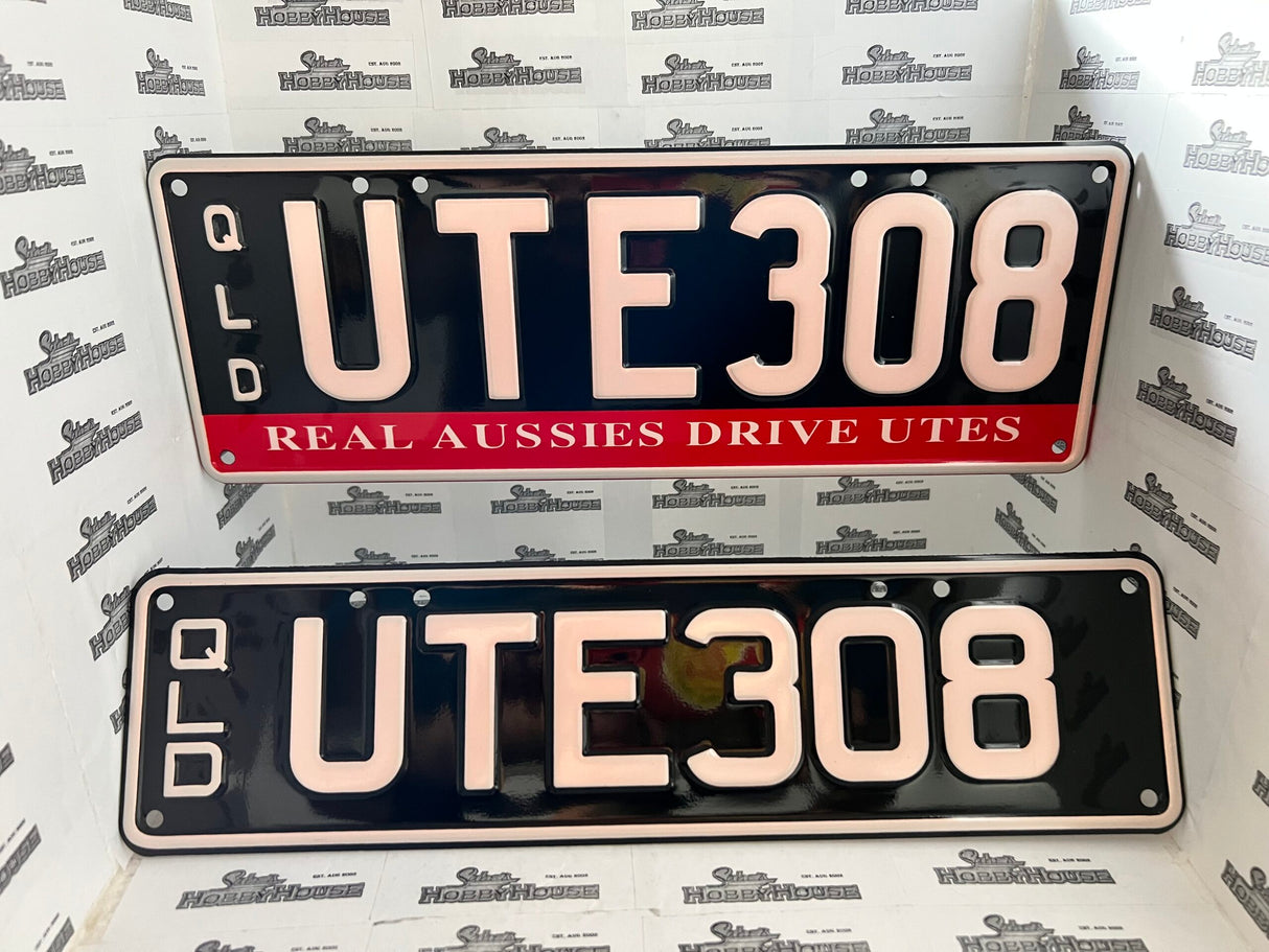 Real Queensland Plates. UTE308 with words REAL AUSSIES DRIVE UTES below.